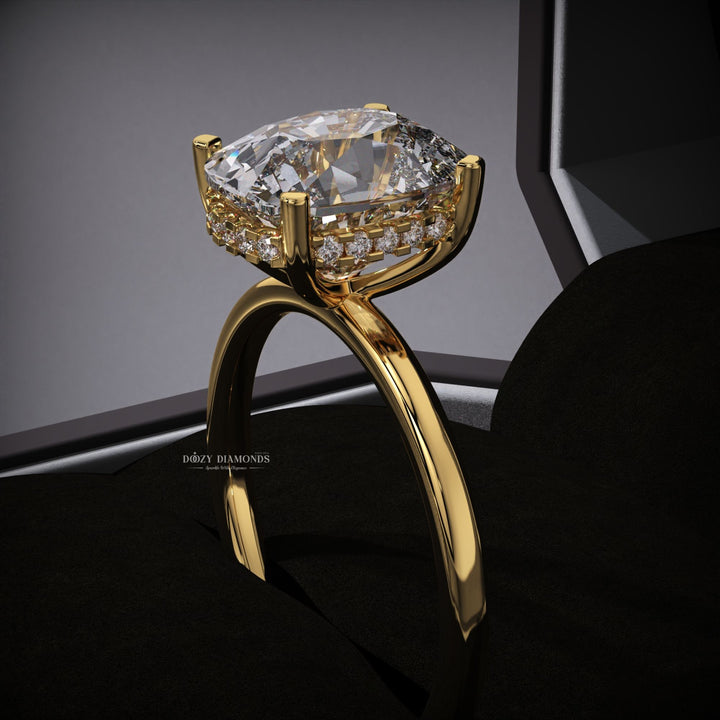 Cushion hidden halo engagement ring offered in gold and platinum