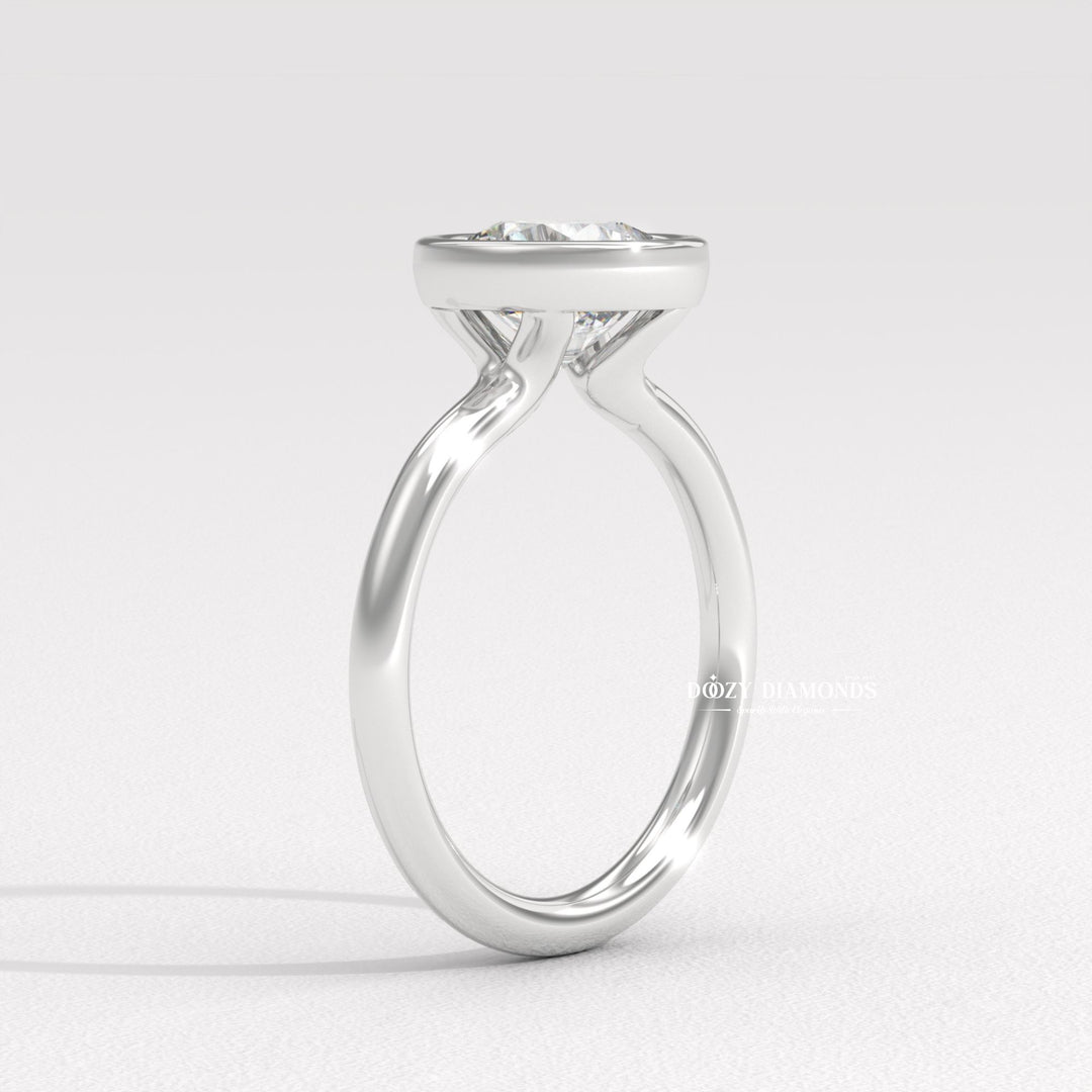 Shop the round cut bezel engagement ring collection online