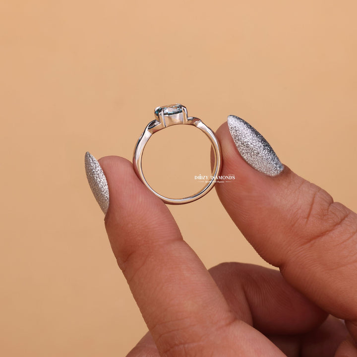 Round cut solitaire engagement ring shown in real-life wear