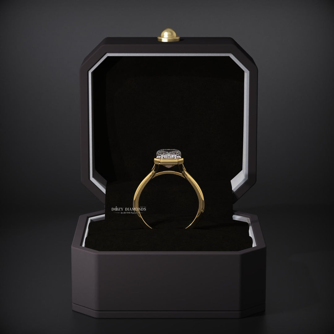 Lifestyle shot of emerald bezel diamond ring on hand