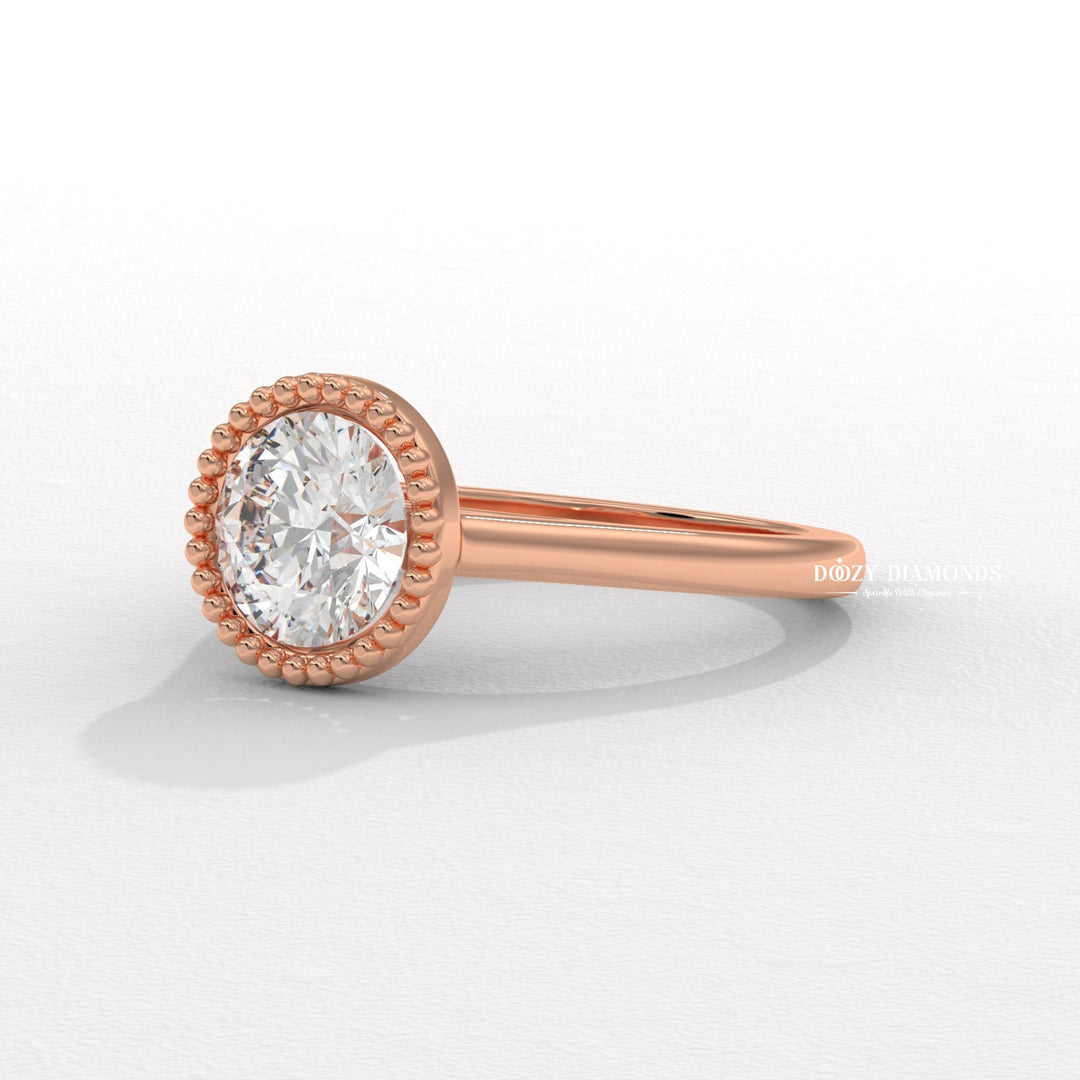 Profile view of round cut bezel engagement ring band