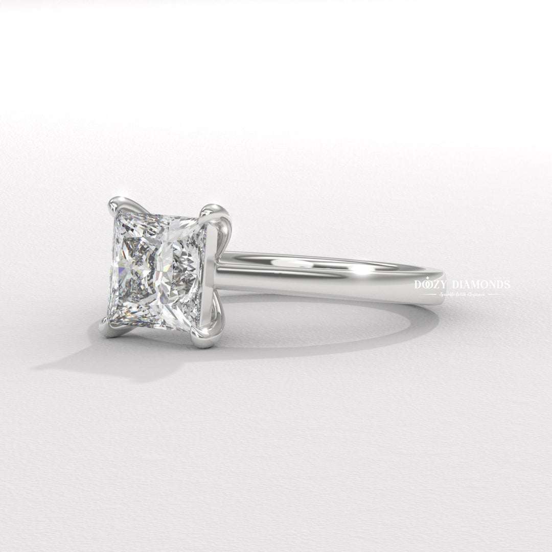 Princess solitaire engagement ring finished in polished solid gold