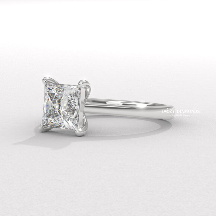 Princess solitaire engagement ring finished in polished solid gold