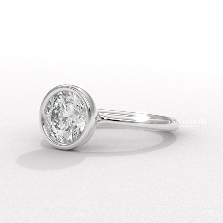 Round cut engagement ring shown with authenticity certificate