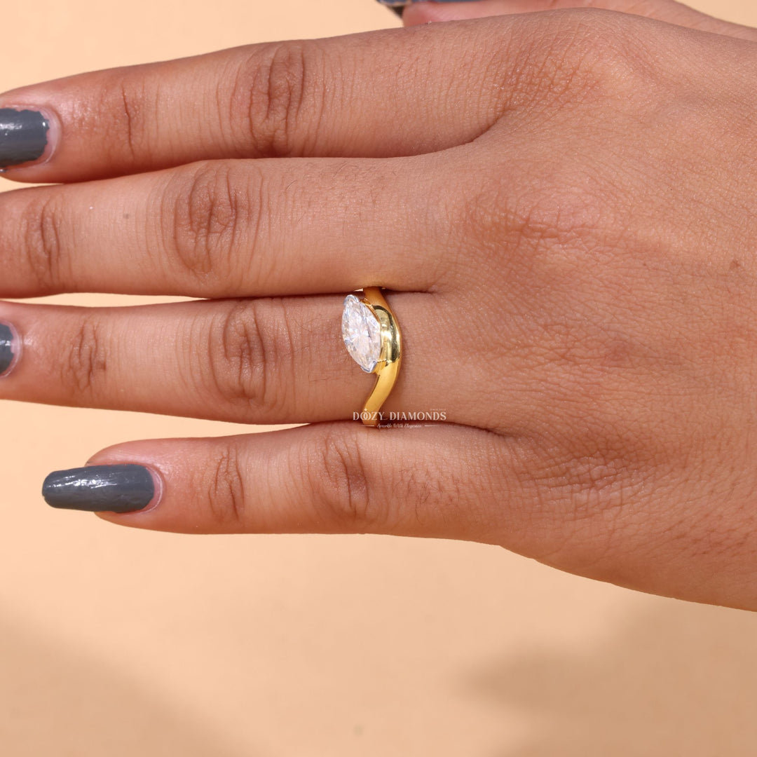 Marquise cut engagement ring shown with authenticity certificate