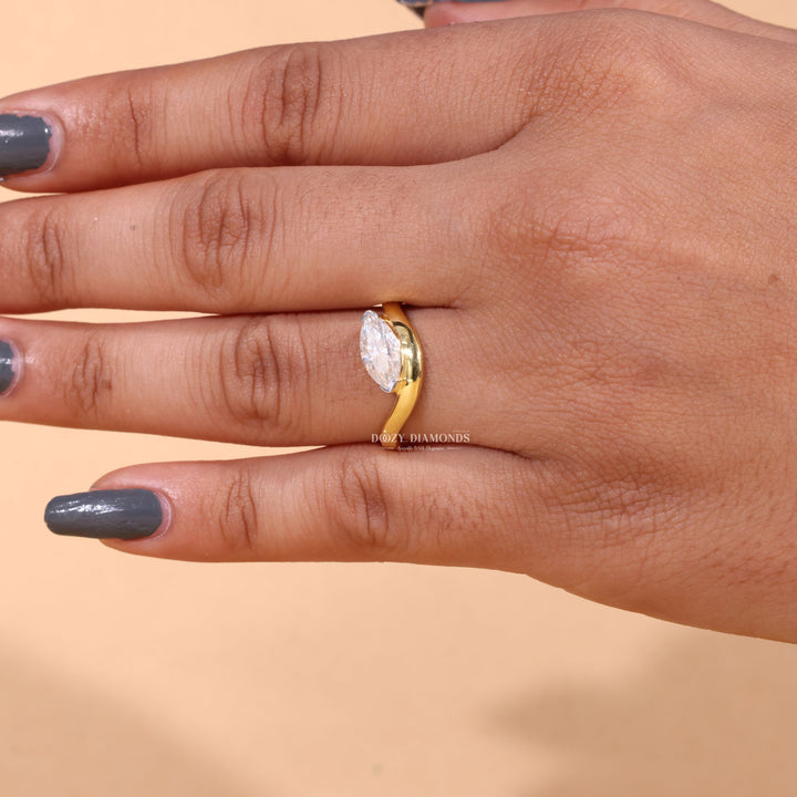 Marquise cut engagement ring shown with authenticity certificate