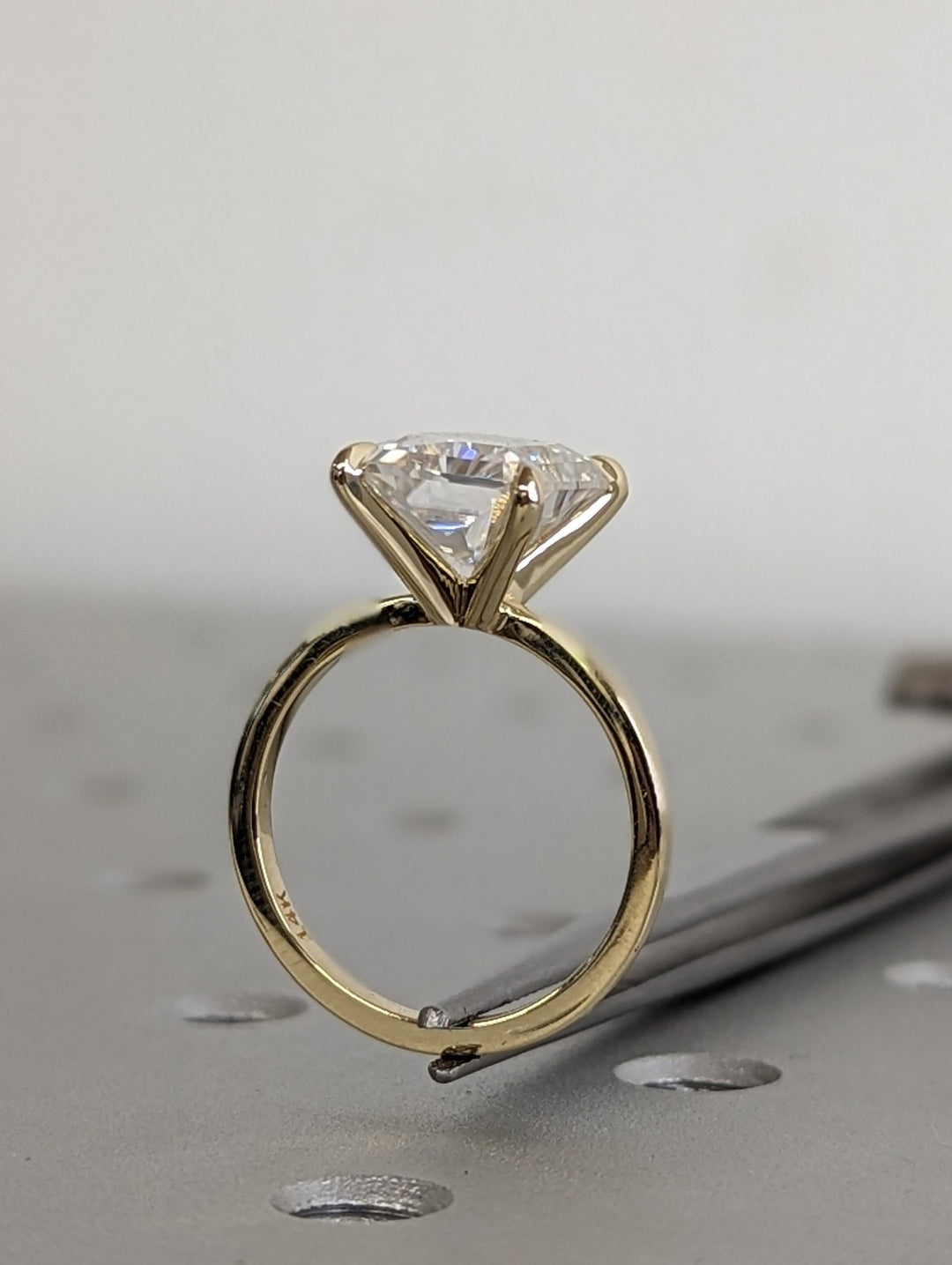Radiant solitaire lab grown diamond ring fitted on finger