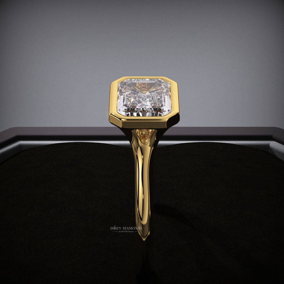 Macro shot of emerald cut diamond facets in east west ring setting