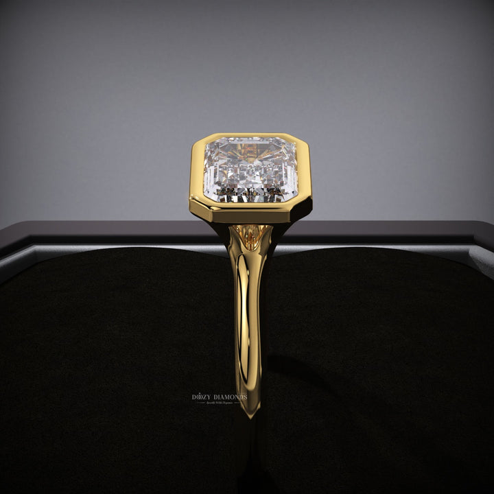 Macro shot of emerald cut diamond facets in east west ring setting