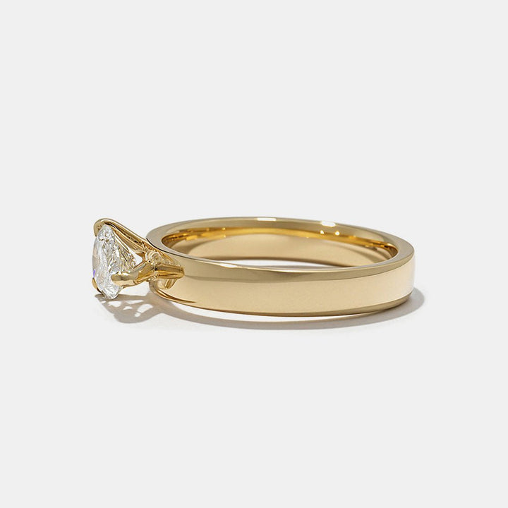 Pear cut engagement ring side view showing band detail