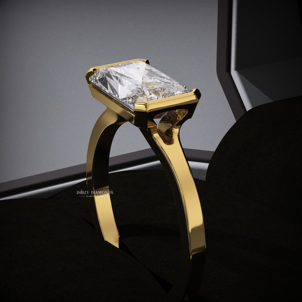 Side angle of radiant east west diamond engagement ring