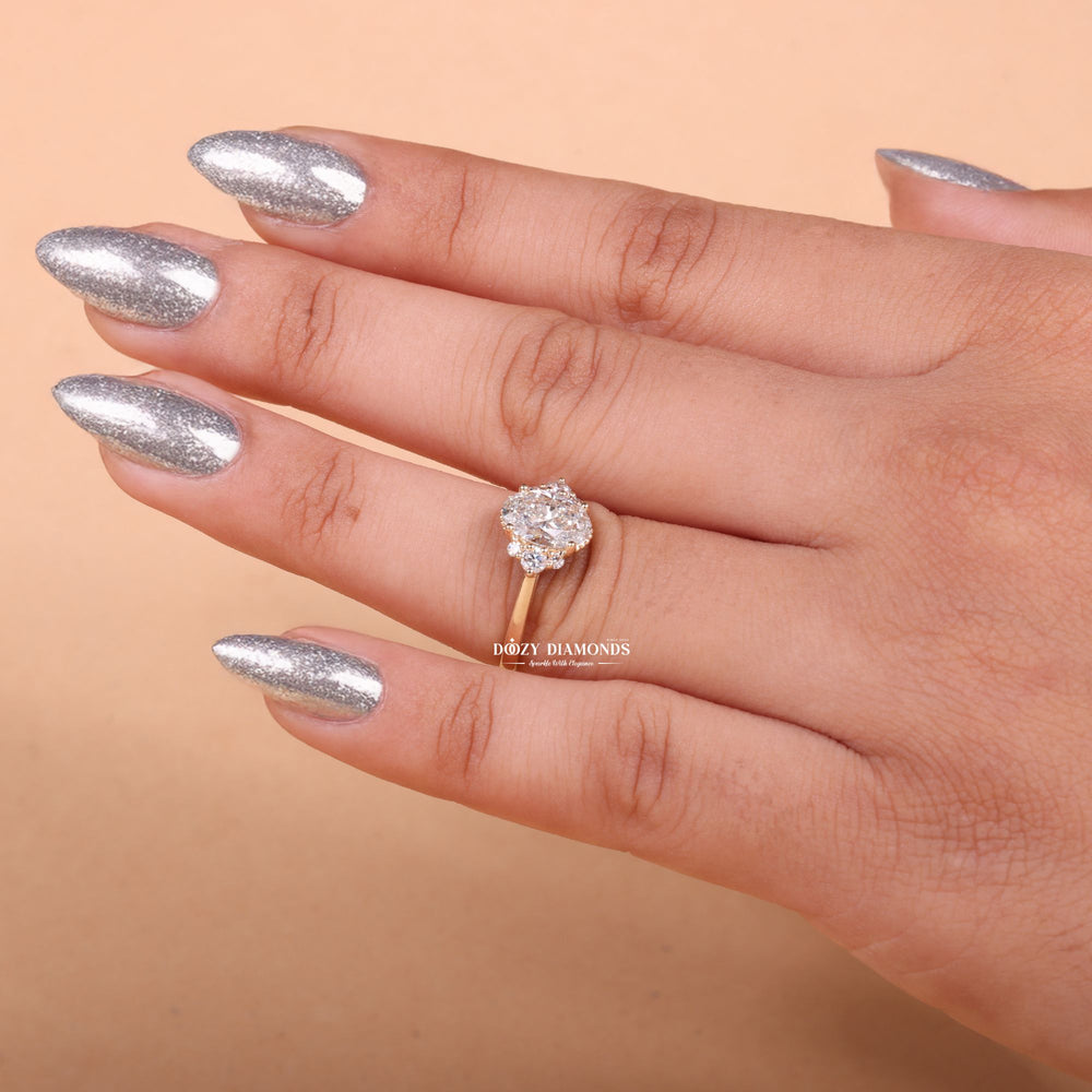 Oval cluster engagement ring viewed from the side