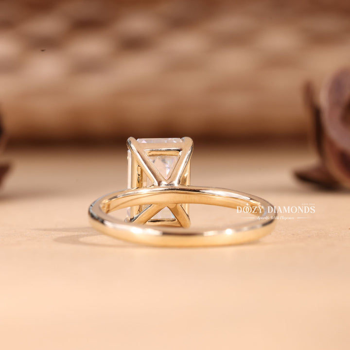 Unboxing view of emerald cut solitaire diamond engagement ring