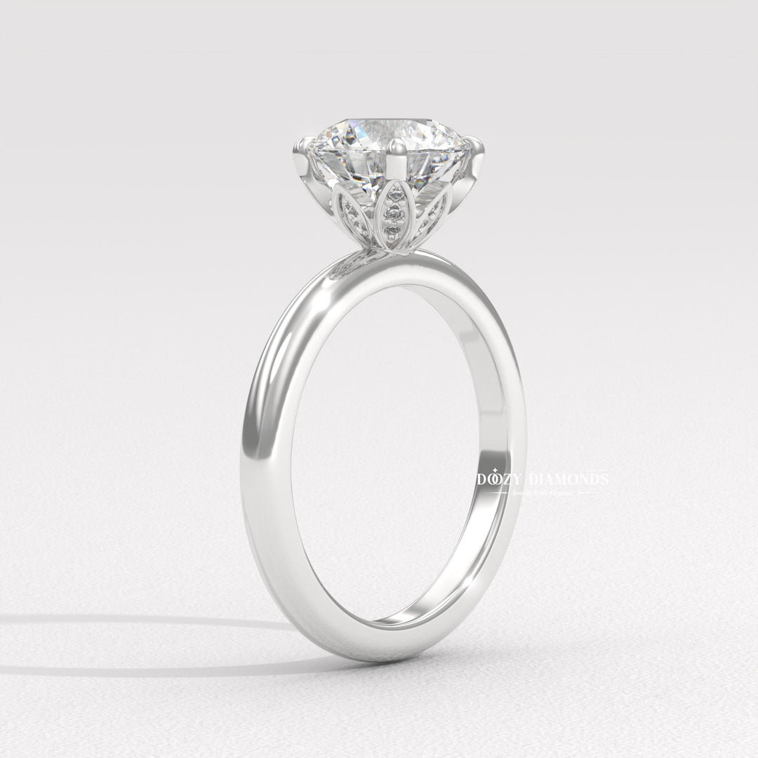 Round cut diamond ring worn on hand