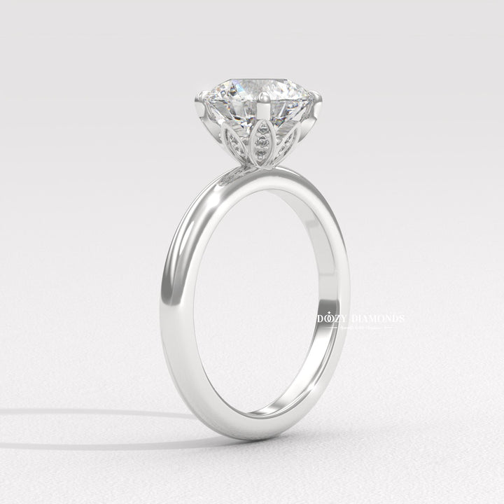 Round cut diamond ring worn on hand