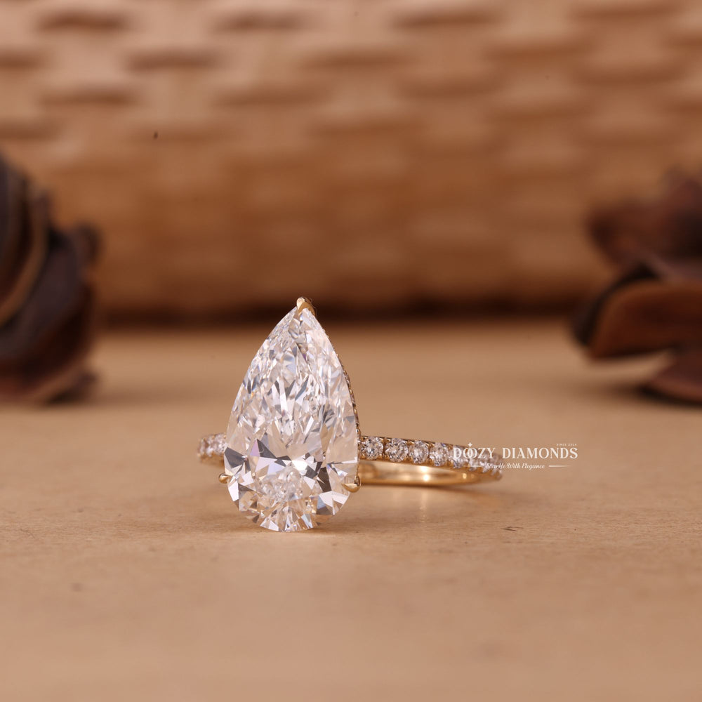 Pear hidden halo lab grown diamond ring side profile in gold setting