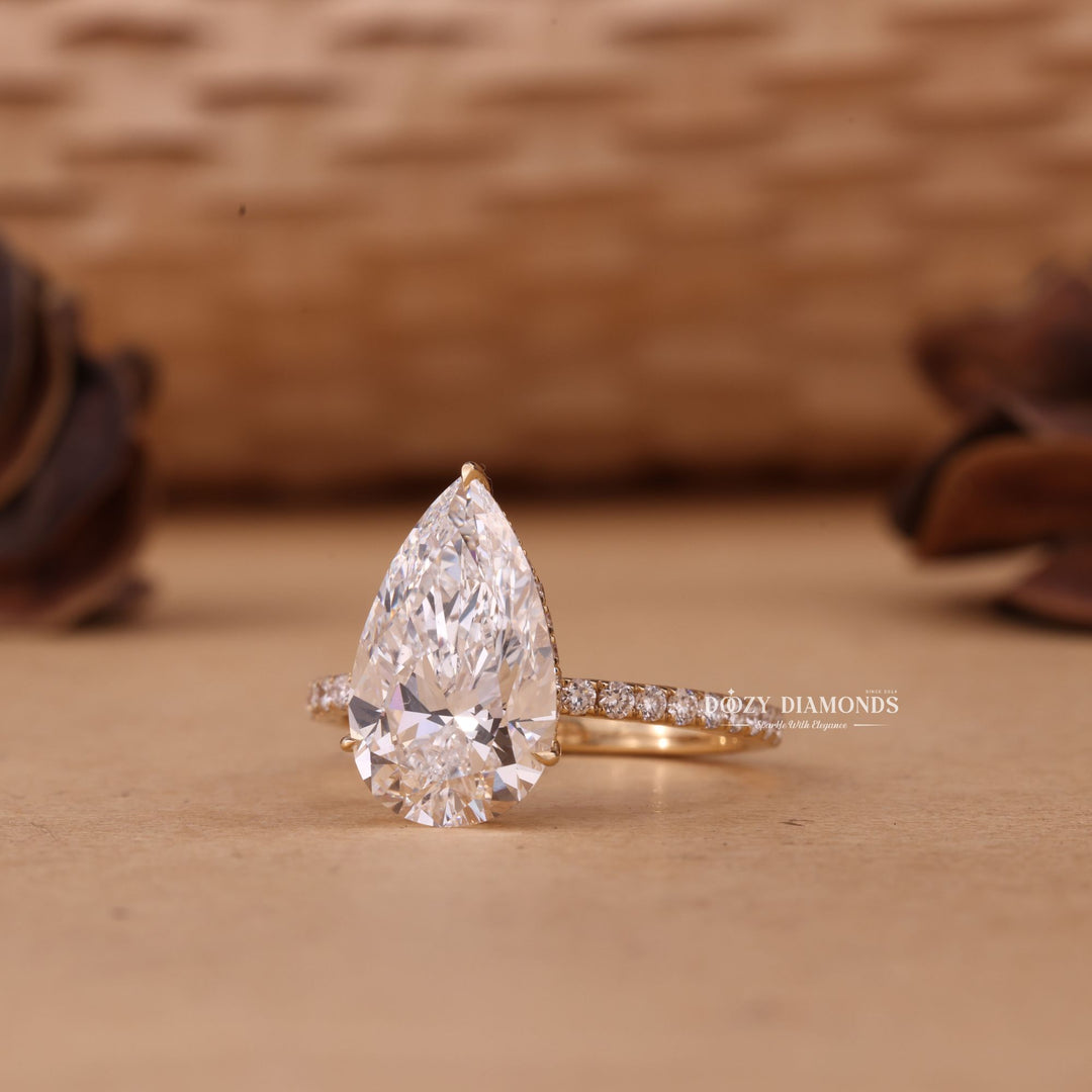 Pear hidden halo lab grown diamond ring side profile in gold setting