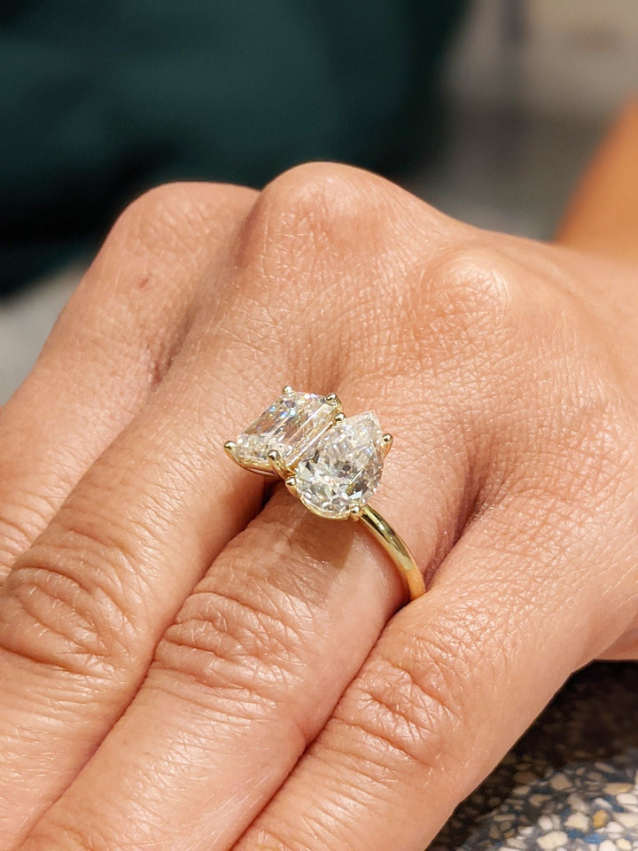 Pear solitaire engagement ring viewed from the side
