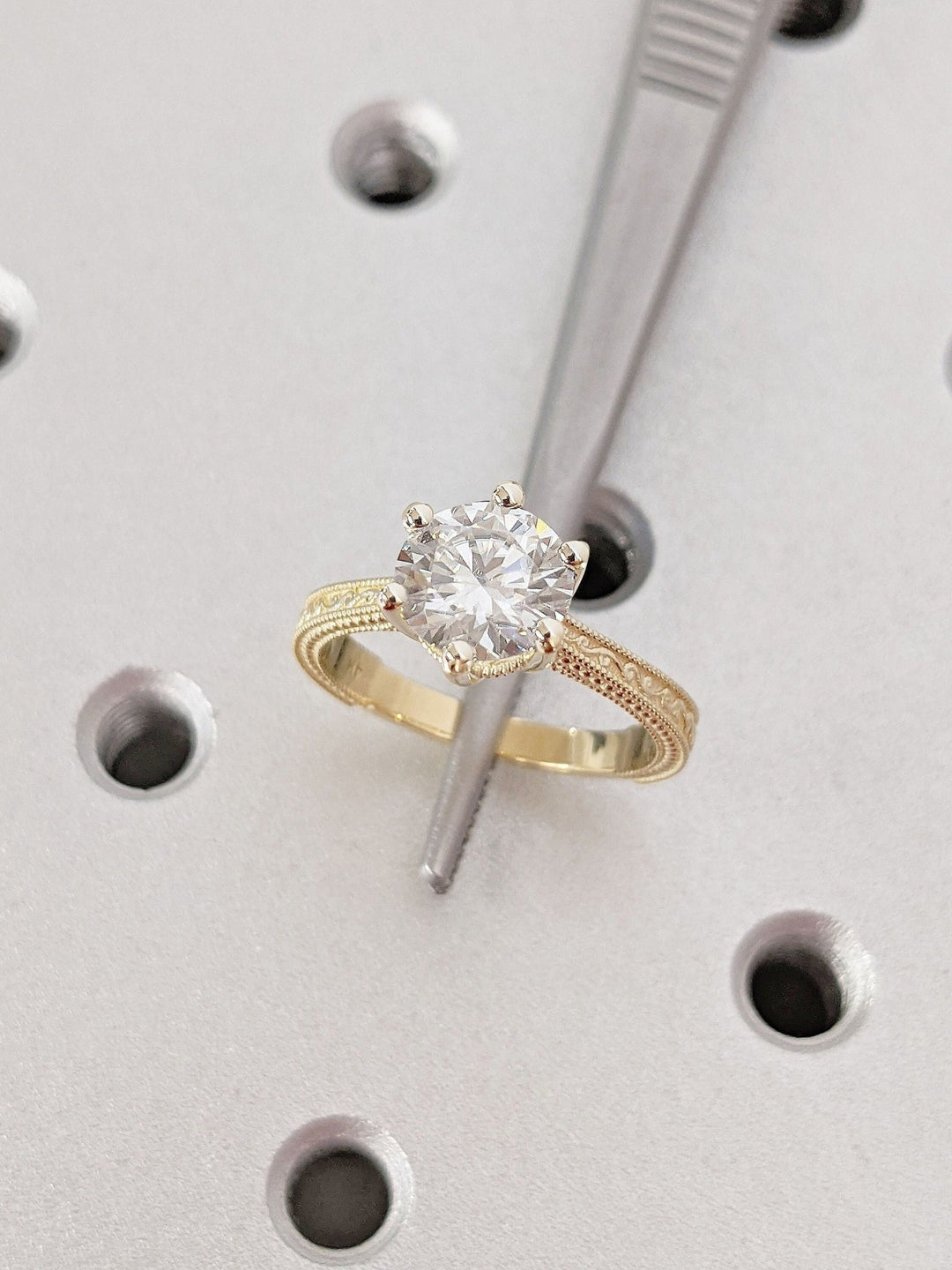 Side angle of round vintage diamond engagement ring