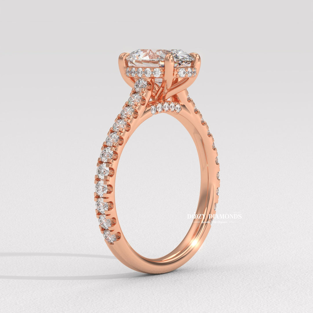 Profile view of oval cut halo engagement ring band