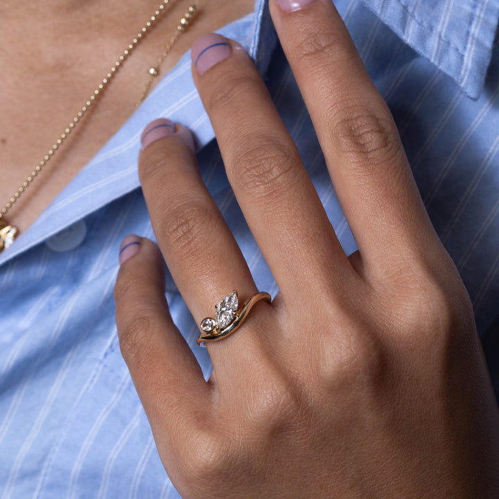 Oval cut engagement ring shown with authenticity certificate