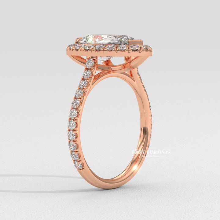 Macro shot of pear cut diamond facets in halo ring setting