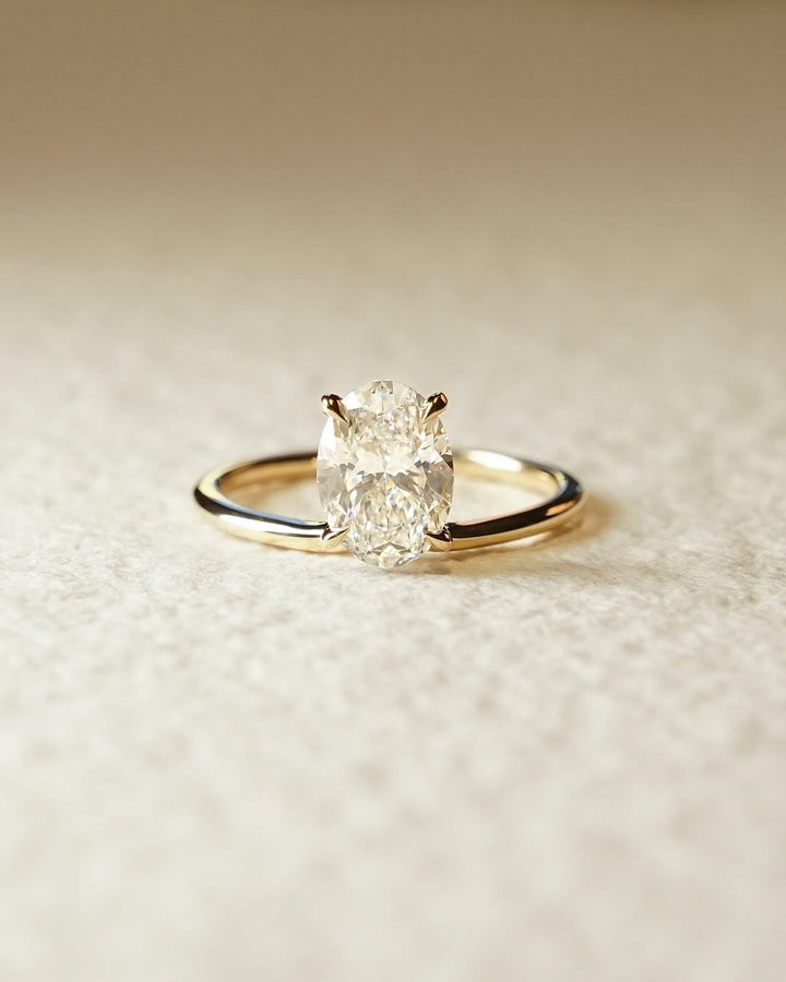 Oval solitaire lab grown diamond ring side profile in gold setting