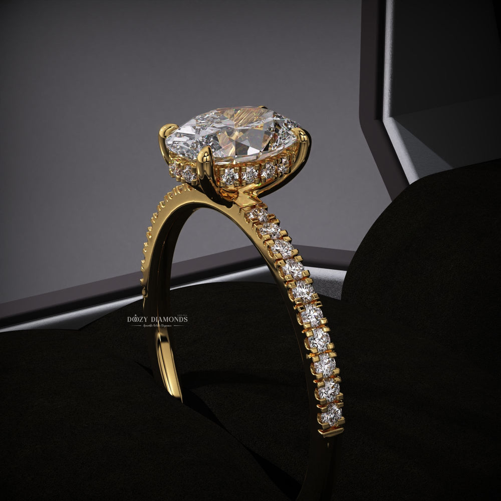 Detailed close-up of oval hidden halo diamond engagement ring