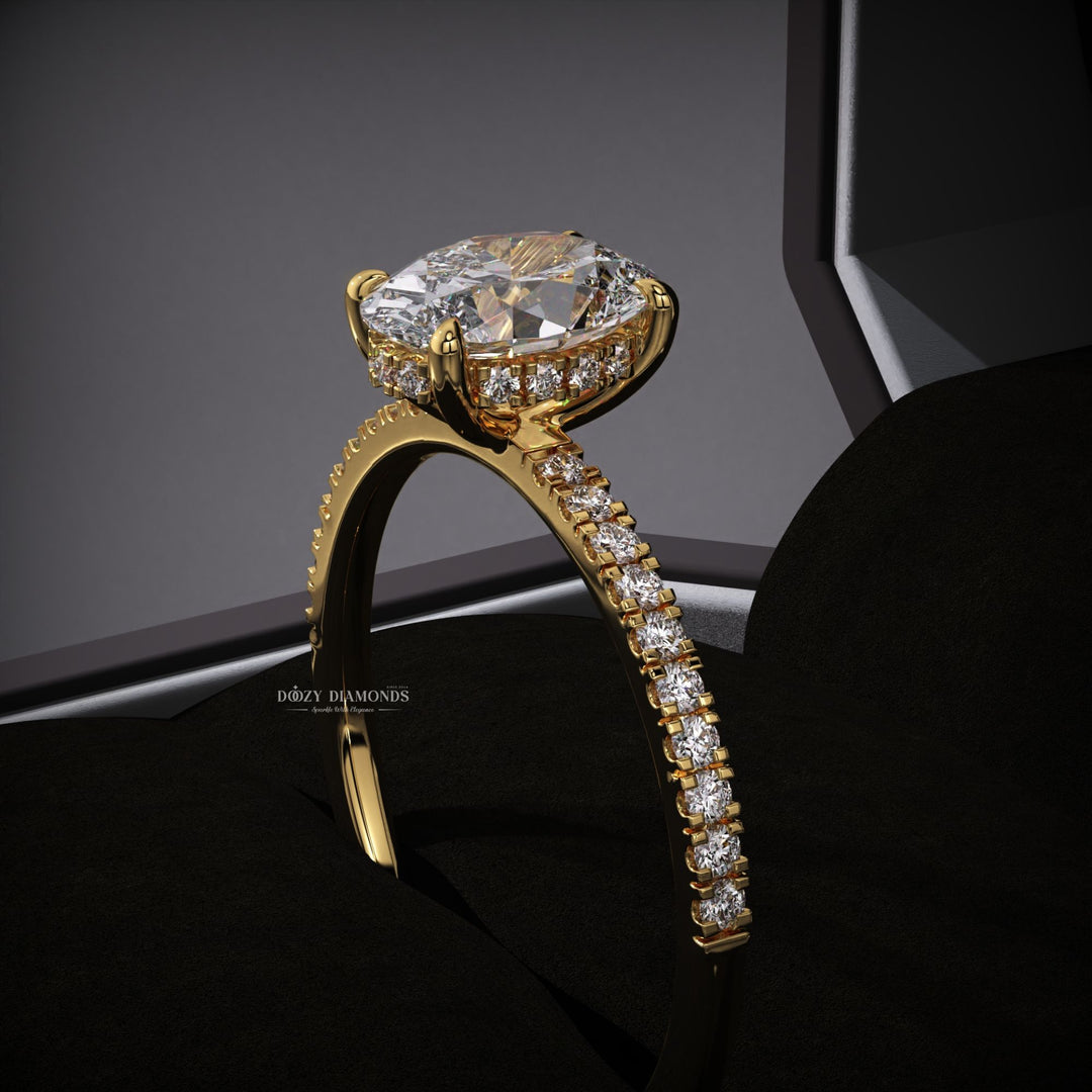 Detailed close-up of oval hidden halo diamond engagement ring