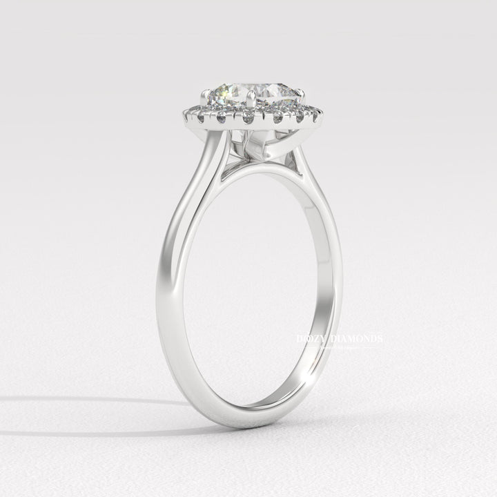 Cushion cut solitaire engagement ring shown in real-life wear