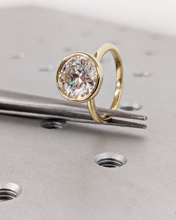 Round cut diamond ring worn on hand