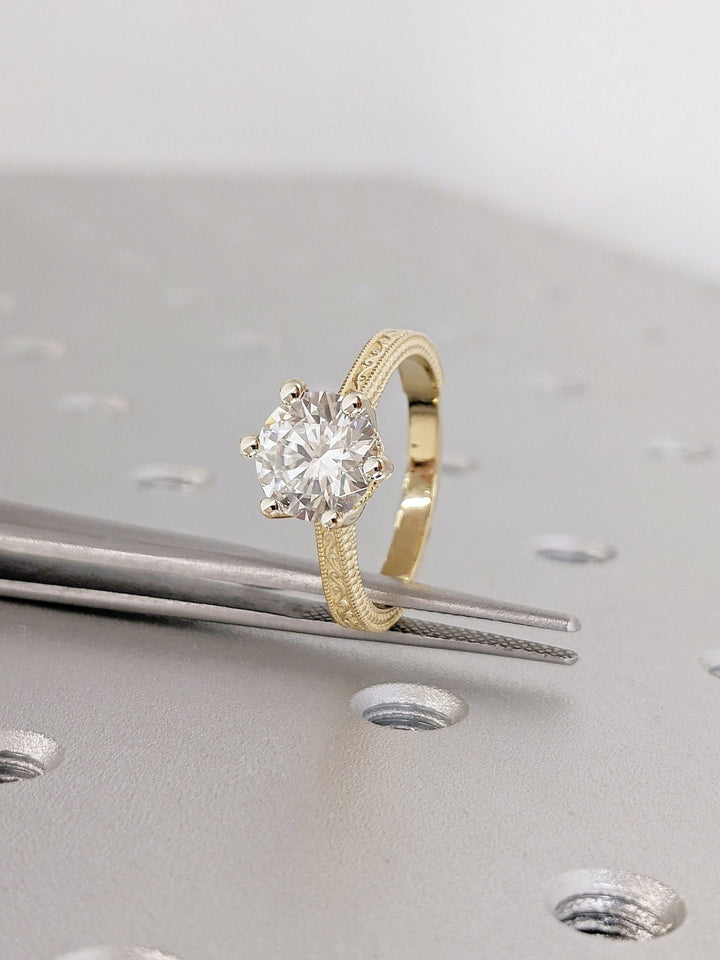 Round cut engagement ring side view showing band detail