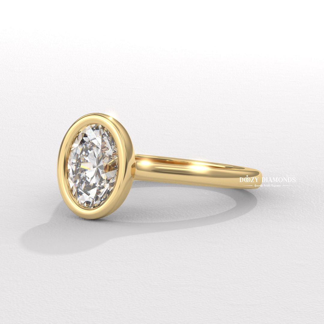 Macro shot of oval cut diamond facets in bezel ring setting
