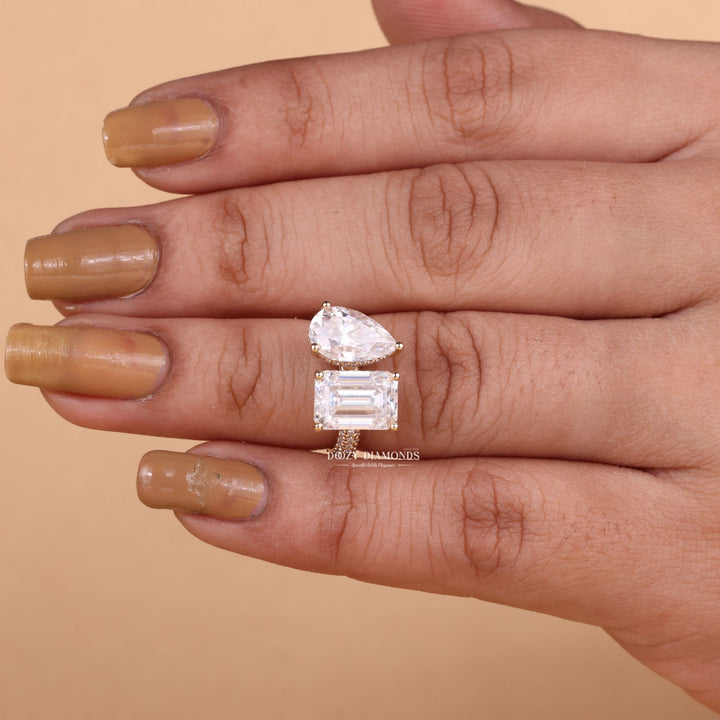 Angled view of pear cut diamond in pave setting