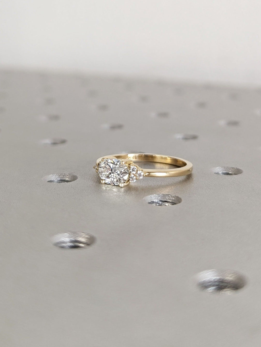 Oval east west diamond ring presented in signature gift packaging