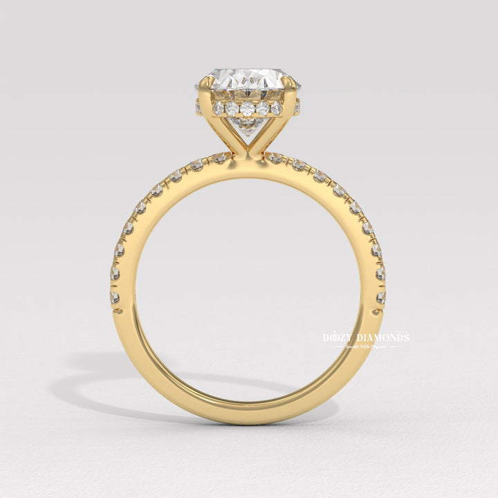 Macro shot of oval cut diamond facets in hidden halo ring setting