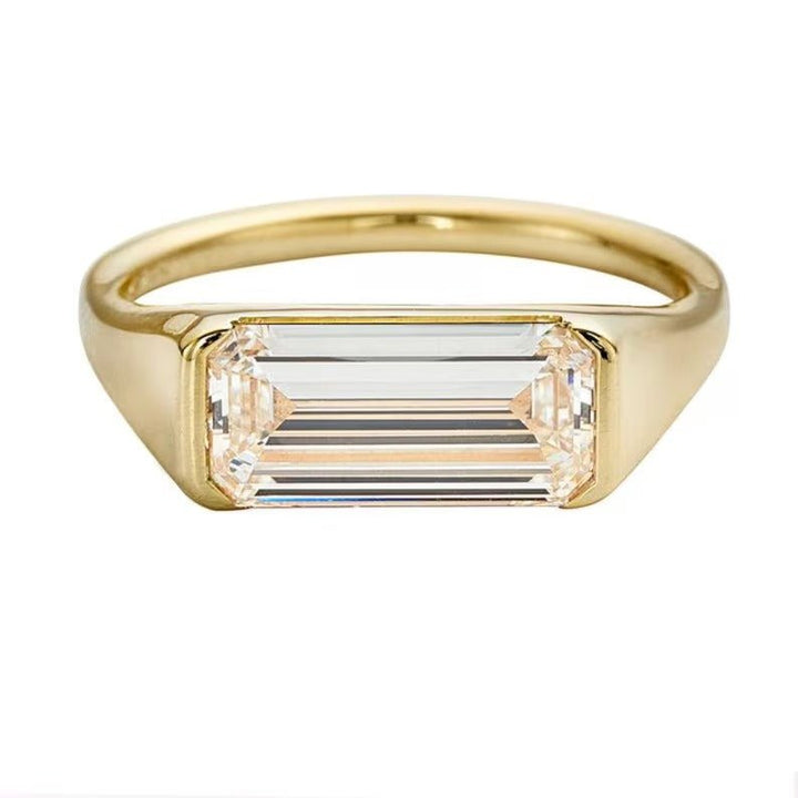 Profile view of emerald cut east west engagement ring band