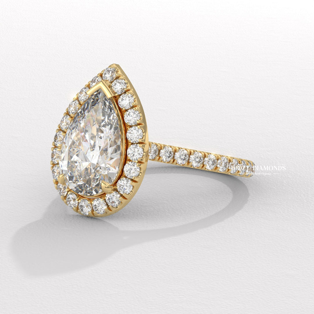 Pear halo engagement ring close-up highlighting diamond sparkle