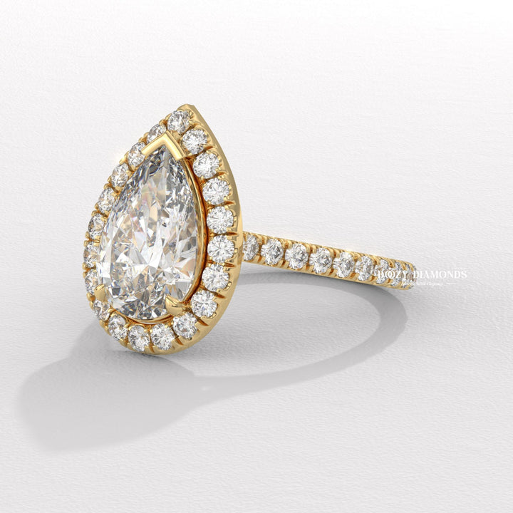 Pear halo engagement ring close-up highlighting diamond sparkle