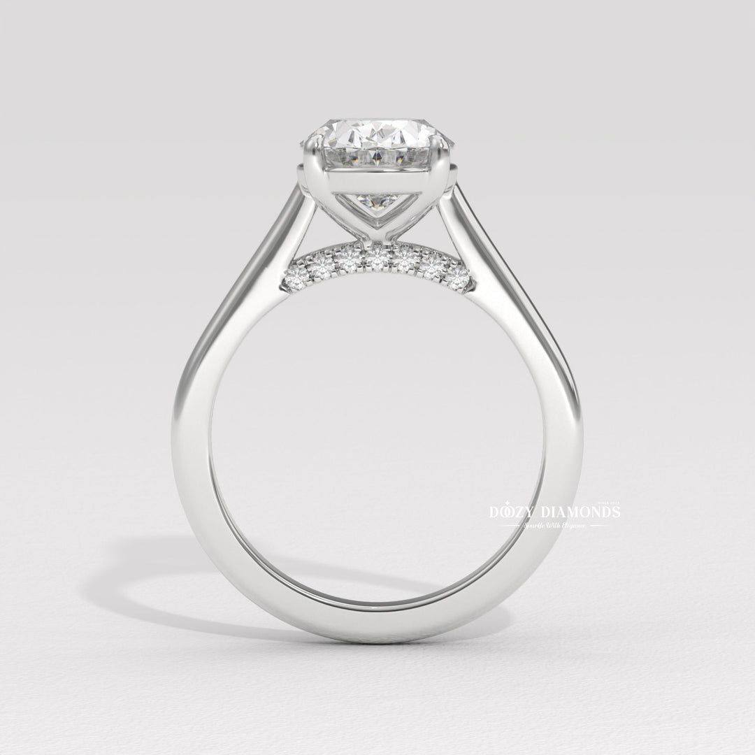Detailed close-up of oval solitaire diamond engagement ring