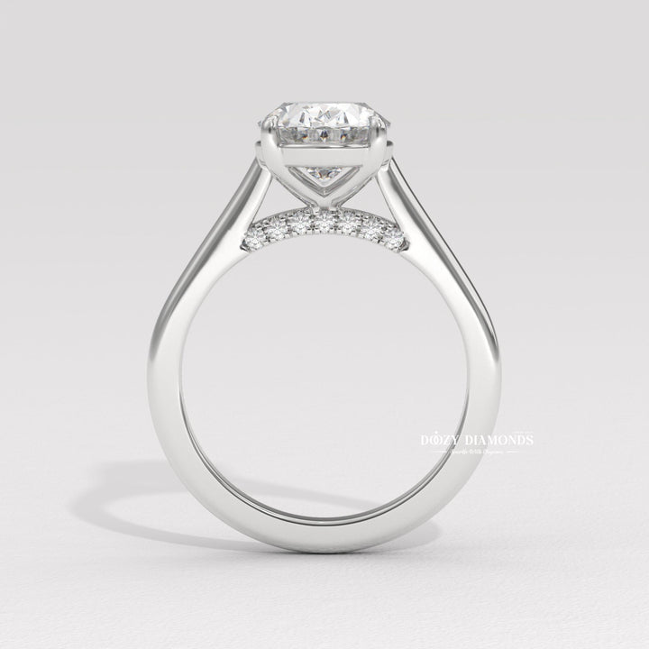 Detailed close-up of oval solitaire diamond engagement ring