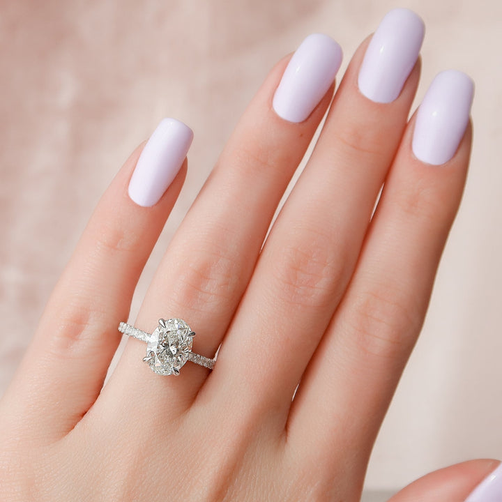 Oval hidden halo lab grown diamond ring side profile in gold setting