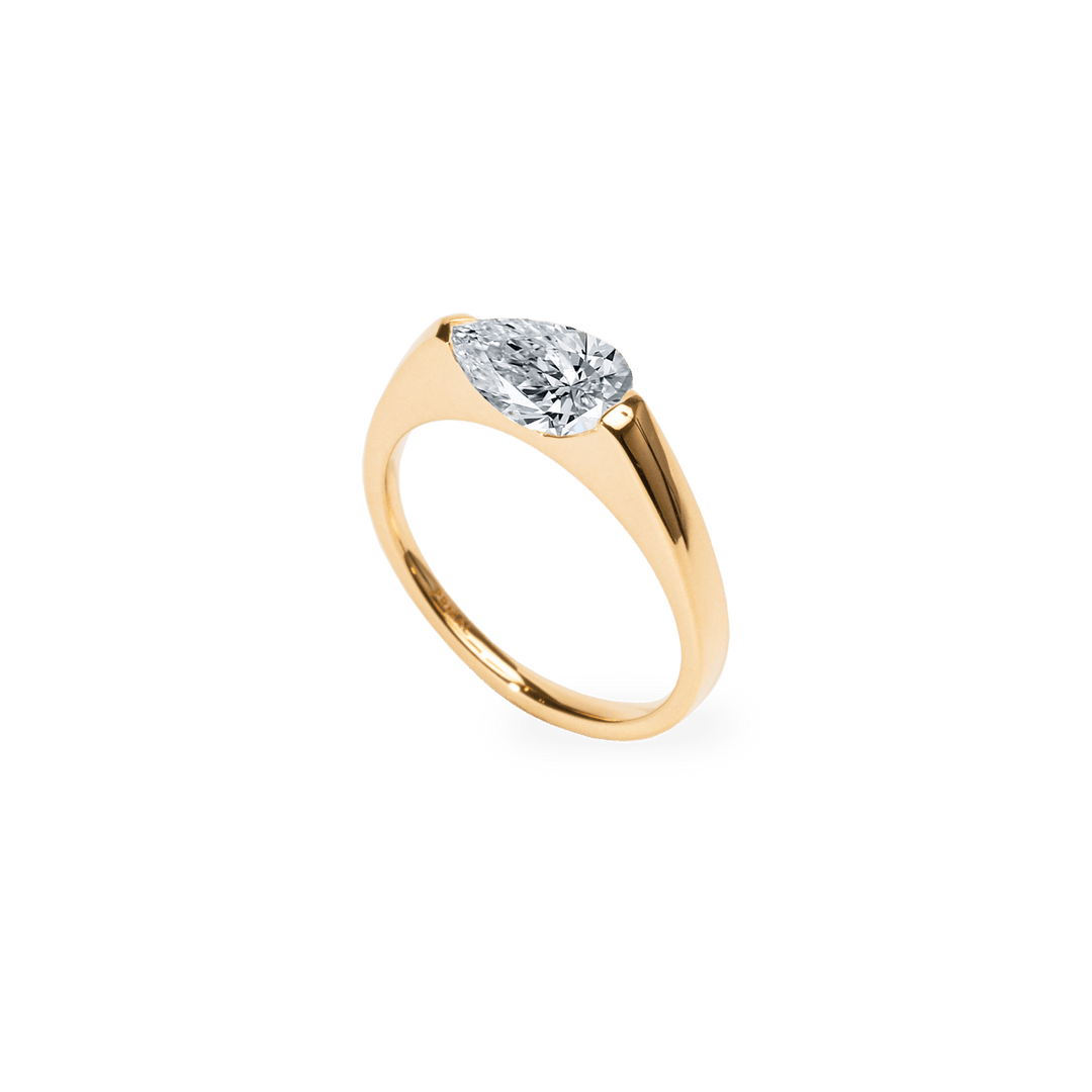 Pear solitaire engagement ring offered in gold and platinum