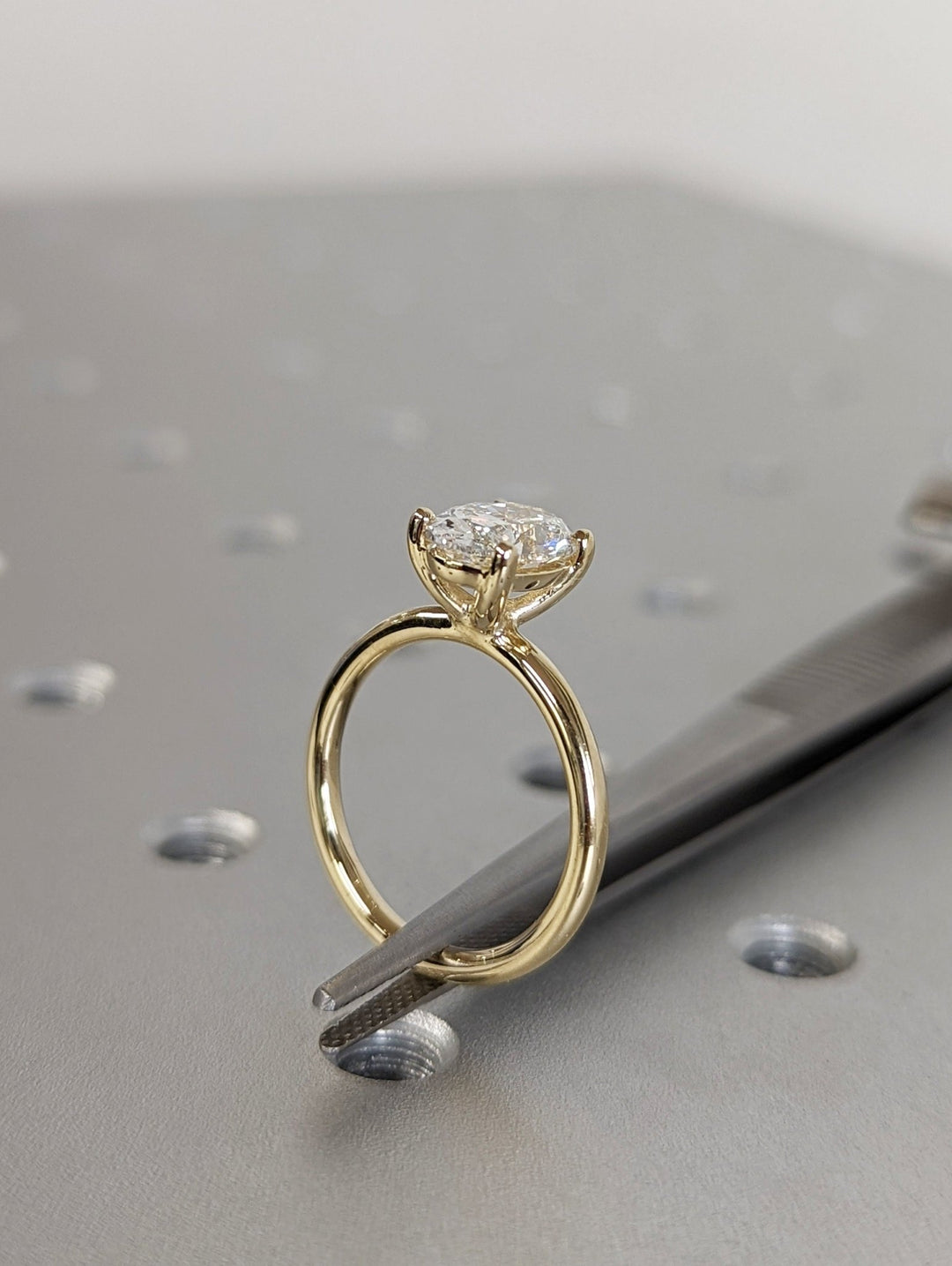 Certified oval cut diamond featured in solitaire engagement ring