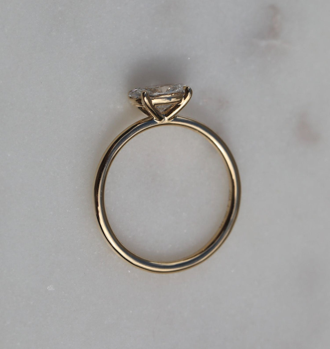 Macro shot of oval cut diamond facets in solitaire ring setting