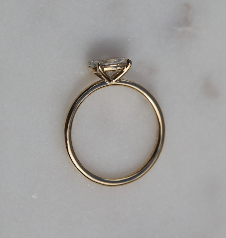 Macro shot of oval cut diamond facets in solitaire ring setting