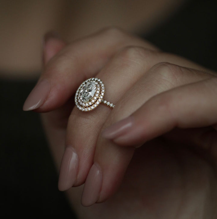 IGI certified oval cut diamond in halo engagement ring setting
