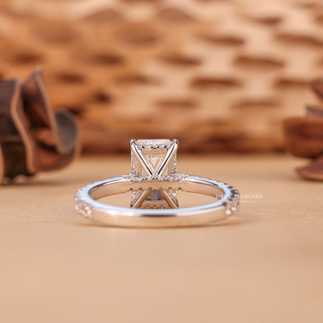 Profile view of radiant cut hidden halo engagement ring band
