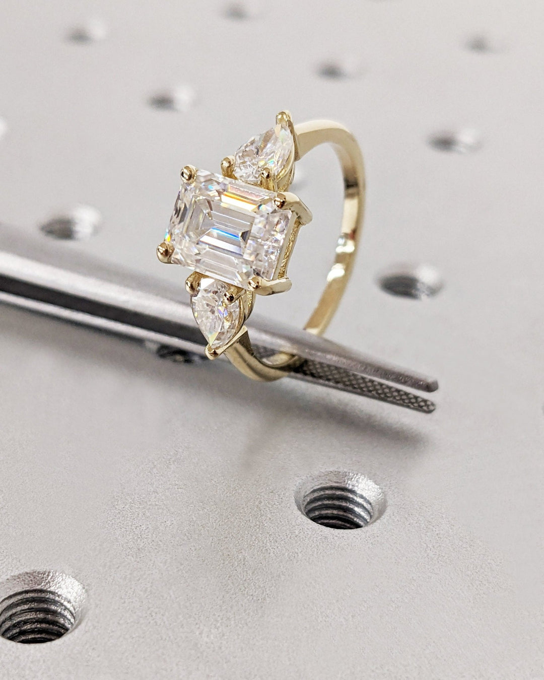 Profile view of emerald cut solitaire engagement ring band