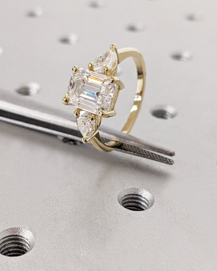 Profile view of emerald cut solitaire engagement ring band